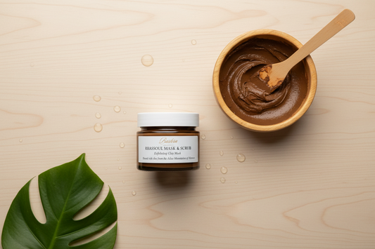Moroccan rhassoul clay from Atlas Mountains with clay paste in wooden bowl for skin and hair