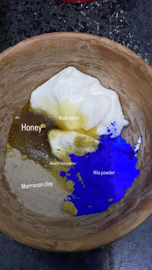 Ingredients for a skincare recipe in a bowl: honey, rose water, Nila powder, and Moroccan clay.