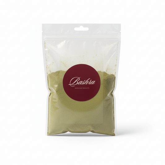 Clear resealable pouch of Bashra Moroccan Products natural henna powder with green herbal blend, burgundy logo label, on white background