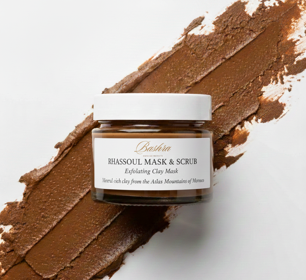 Jar of Ghassoul Mask & Scrub with brown paste on a white background