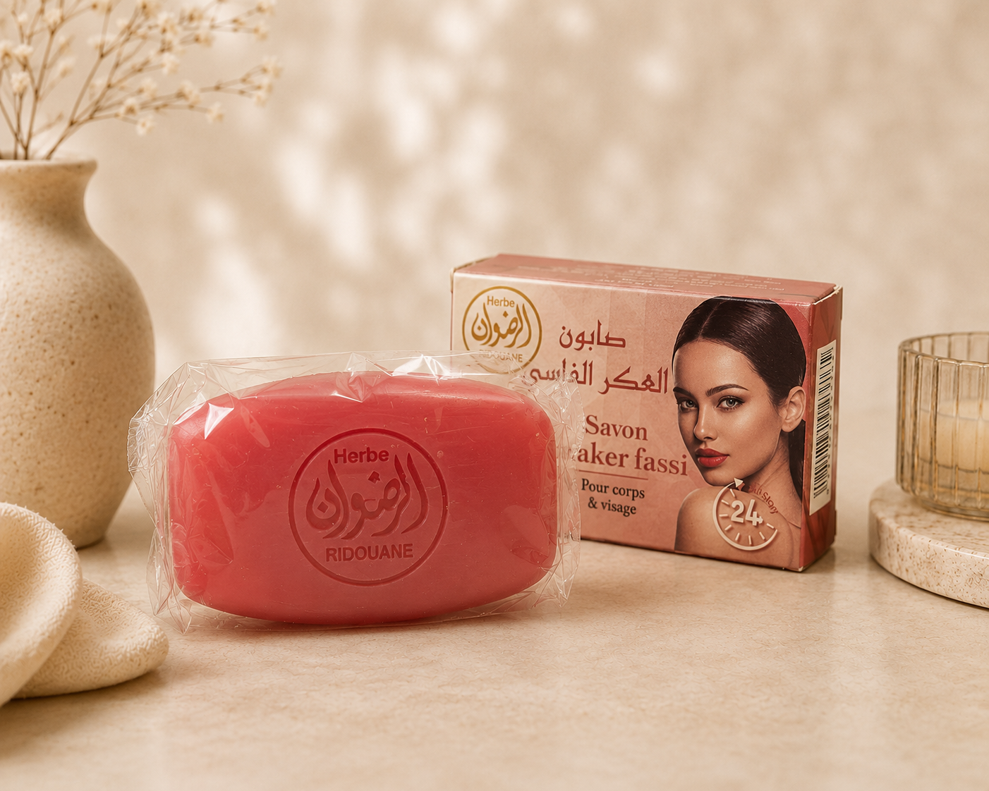 Authentic Moroccan Aker Fassi rose soap bar with its packaging displayed in a luxury spa-inspired setting by Bashra Beauty for naturally radiant skin.