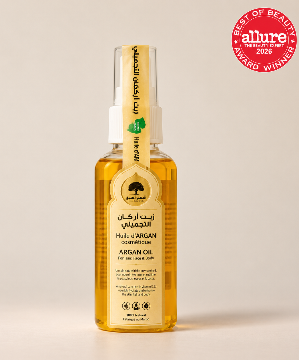 Bashra Beauty 100% natural Moroccan argan oil in a golden bottle with a cream label and white spray cap.