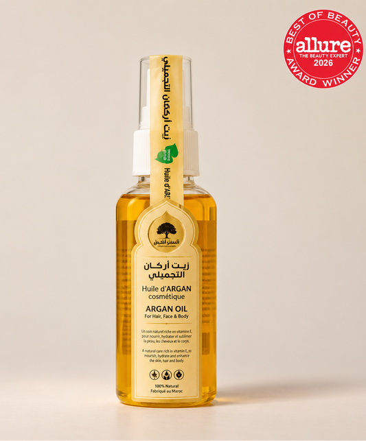 Bashra Beauty 100% natural Moroccan argan oil in a golden bottle with a cream label and white spray cap.