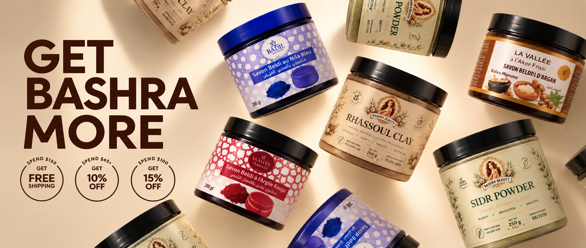 Bashra Beauty Moroccan skincare collection featuring rhassoul clay, sidr powder, argan beldi soap, red clay beldi soap, and blue nila beldi soap in a warm beige luxury flat-lay banner