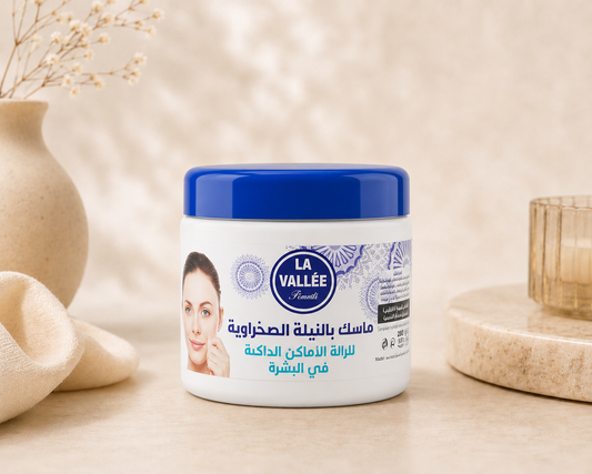 La Vallée Blue Nila Mask skincare product displayed in a luxury spa setting. Traditional Moroccan blue indigo mask designed to help brighten skin, improve uneven skin tone, and promote a smoother-looking complexion.